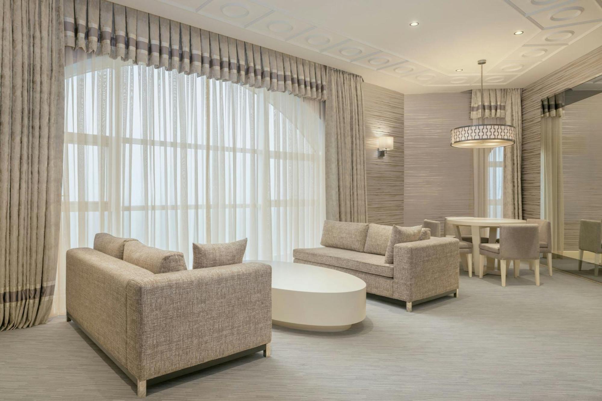 Sheraton Batumi Hotel Exterior foto A living room with a large window